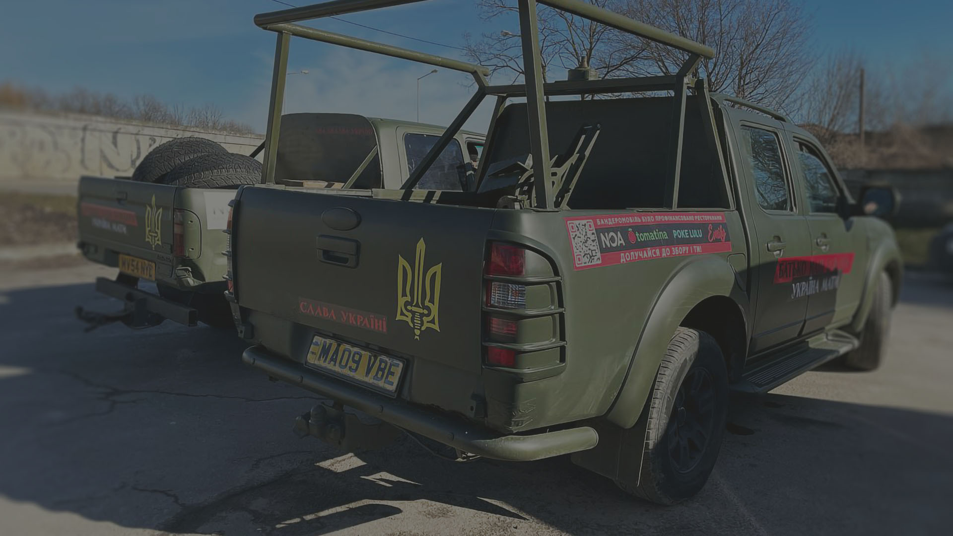 Two donated pickup trucks were painted, branded and filled with supplies for the Ukrainian army.